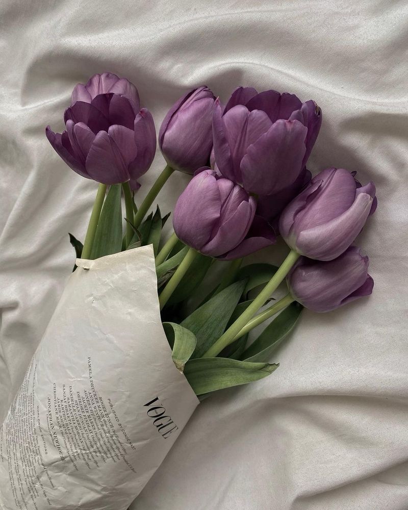 Purple flowers wrapped in vogue paper