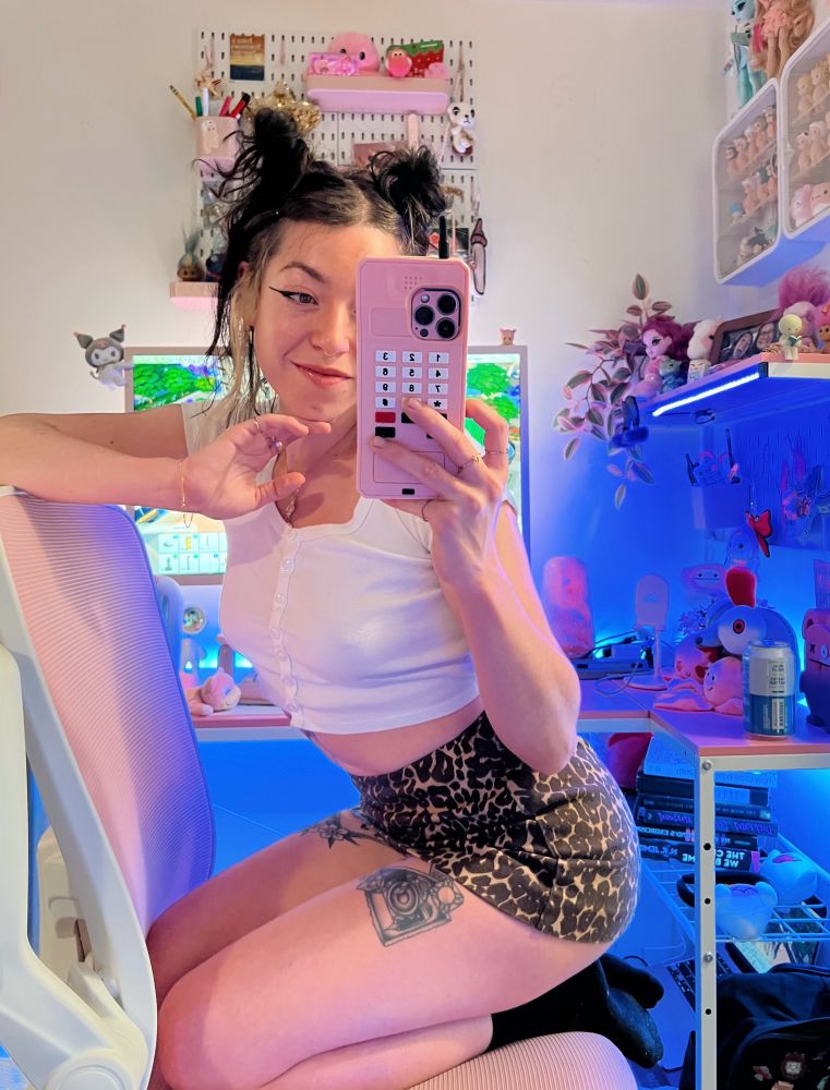 rocket with her hair in bunnies and a lil white tee and the leopard print skirt she got on sale at cotton on for 8$!!!!!
