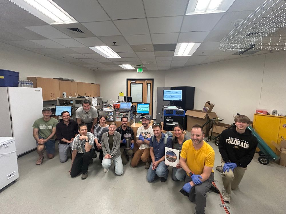 Our joint CU NOAA research team standing in front of science equipment. 