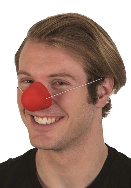 photo of a young man wearing a red clown nose.