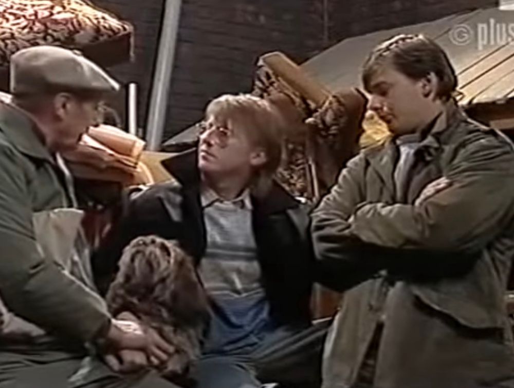 Sam Tindall being looked at disapprovingly by Our Terry Duckworth, and adoringly by his canine companion, in Len’s filthy yard.  They are surrounded by clutter and rubbish. 