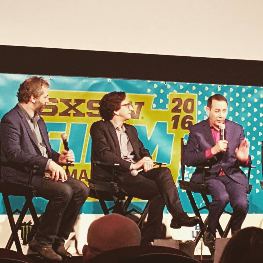 Judd Apatow, Paul Rust & Paul Reubens, seated at a Q&A for PEE-WEE'S BIG HOLIDAY during SXSW 2016.