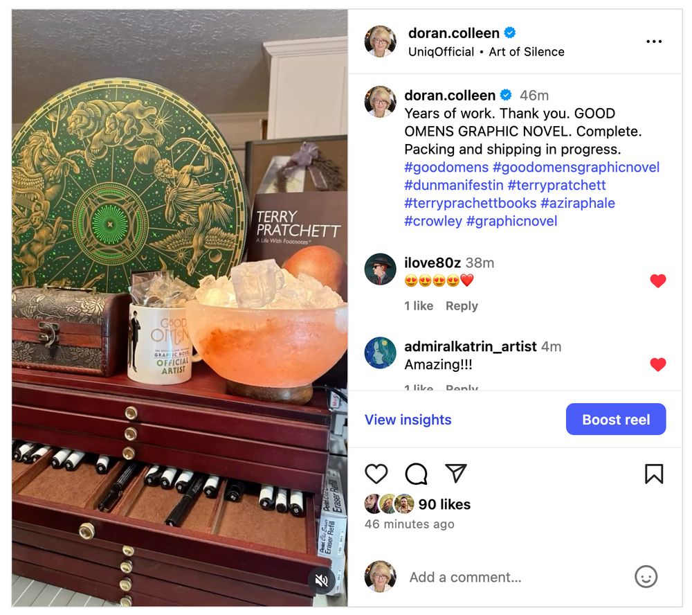 A screen shot of a reel on Instragram showing Colleen Doran's studio during Good Omens production. There is a cabinet for pens, a salt lamp, a box with Zodiac decorations, a Terry Pratchett biography