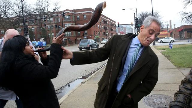 the infamous picture of rahm emanuel cringing as a shofar is blown in his face