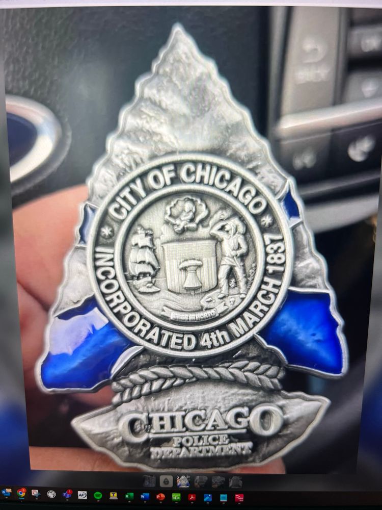 cpd arrowhead medallion with the city of chicago seal on it 