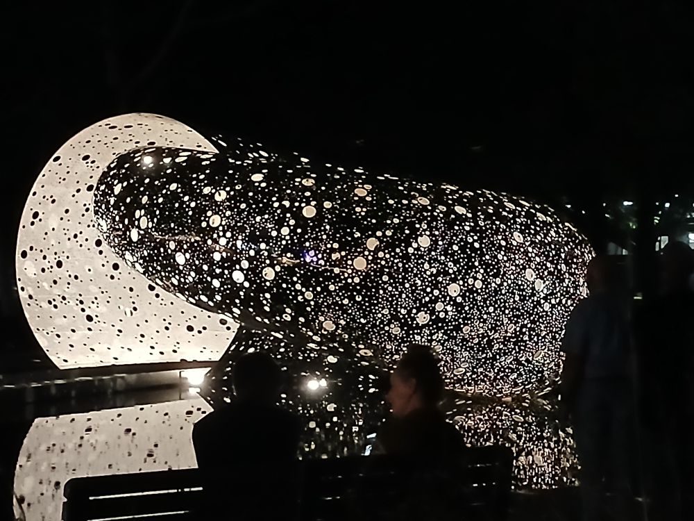 Ouroboros Lindy Lee Sculpture at NGA - night time view