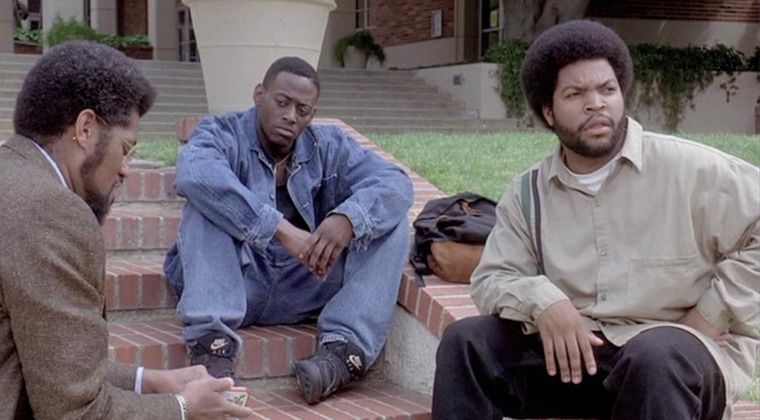 Three men on college campus set of the movie Higher Learning. 