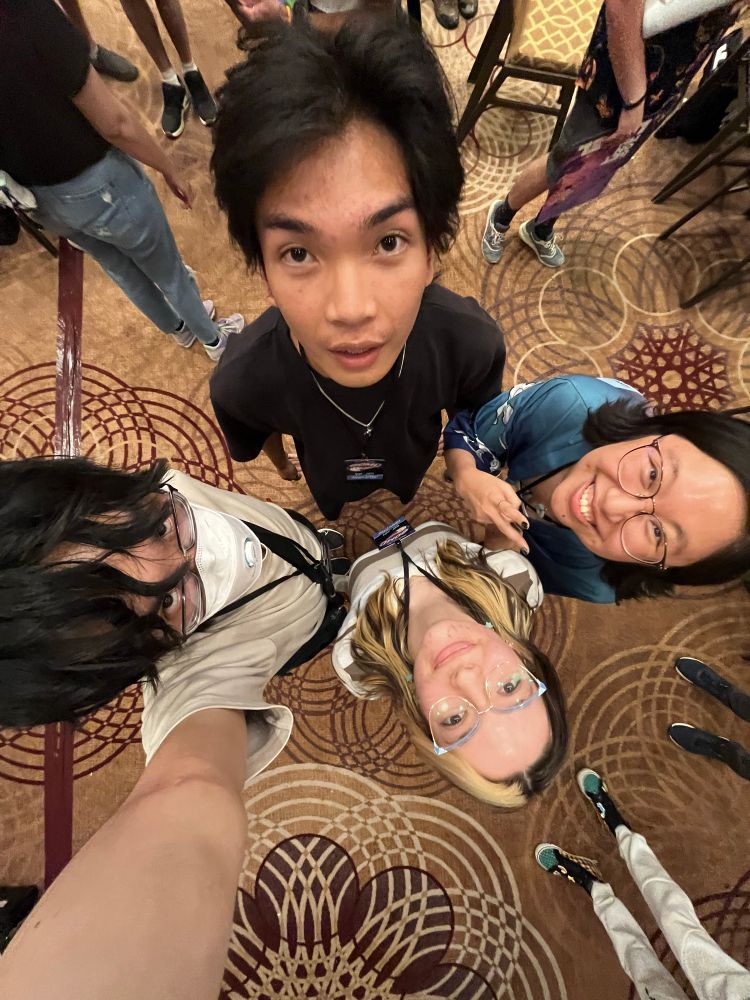 Photo taken above with wide angle of saltwyn, pixel, nicki, and tan looking up