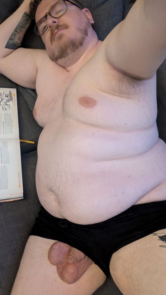 Reading on the couch in just my shorts.. might be something extra peeking out
