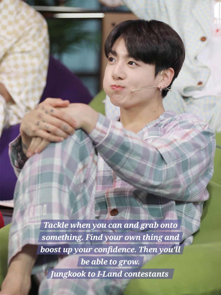 Jungkook blowing air into one check sitting on a beanbag in pajamas and quote "Tackle when you can and grab onto something. Find your own thing and boost up your confidence. Then you'll be able to grow" from Jungkook providing guidance to I-Land contestants