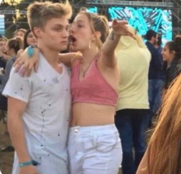 Drunk girl yelling at nonplussed guy meme 