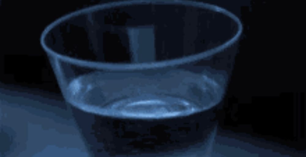 The cup of water shaking on the dashboard as a T-Rex approaches in Jurassic Park