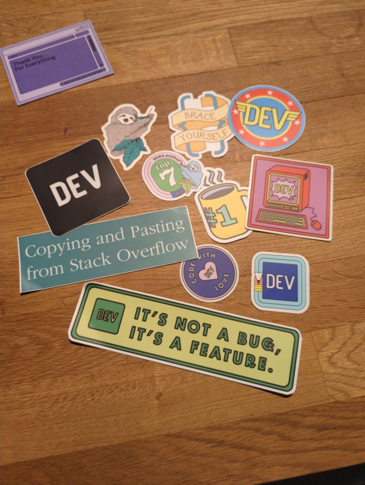 Various software engineering themed stickers on a counter.