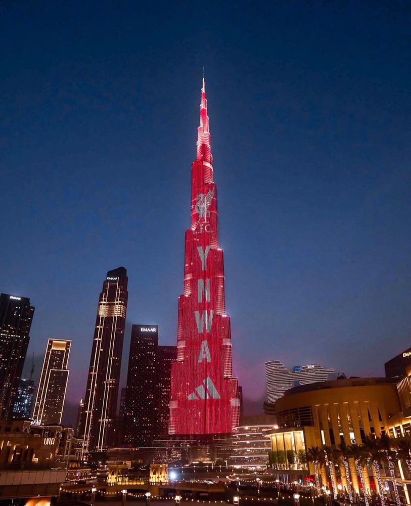 burj khalifa projected with liverpool fc on it