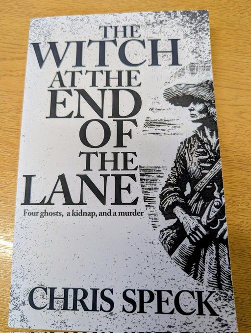 The cover of "The witch at the end of the lane" It depicts a woman, who may or not be the witch in question, (we don't know, we haven't read the book yet). She is waring a large hat and holding a musket.