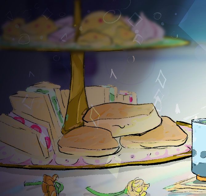 a high tea stand of scones and small sandwhiches
