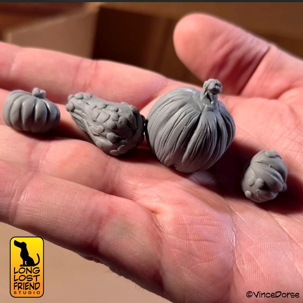 Work in progress of unpainted polymer clay pumpkins and gourds. 