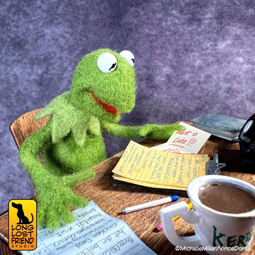 Needle felted Kermit the Frog sitting at his cluttered desk backstage
Felted Kermit by @runredrun.bsky.social
Miniature desk diorama by @vincedorse.bsky.social