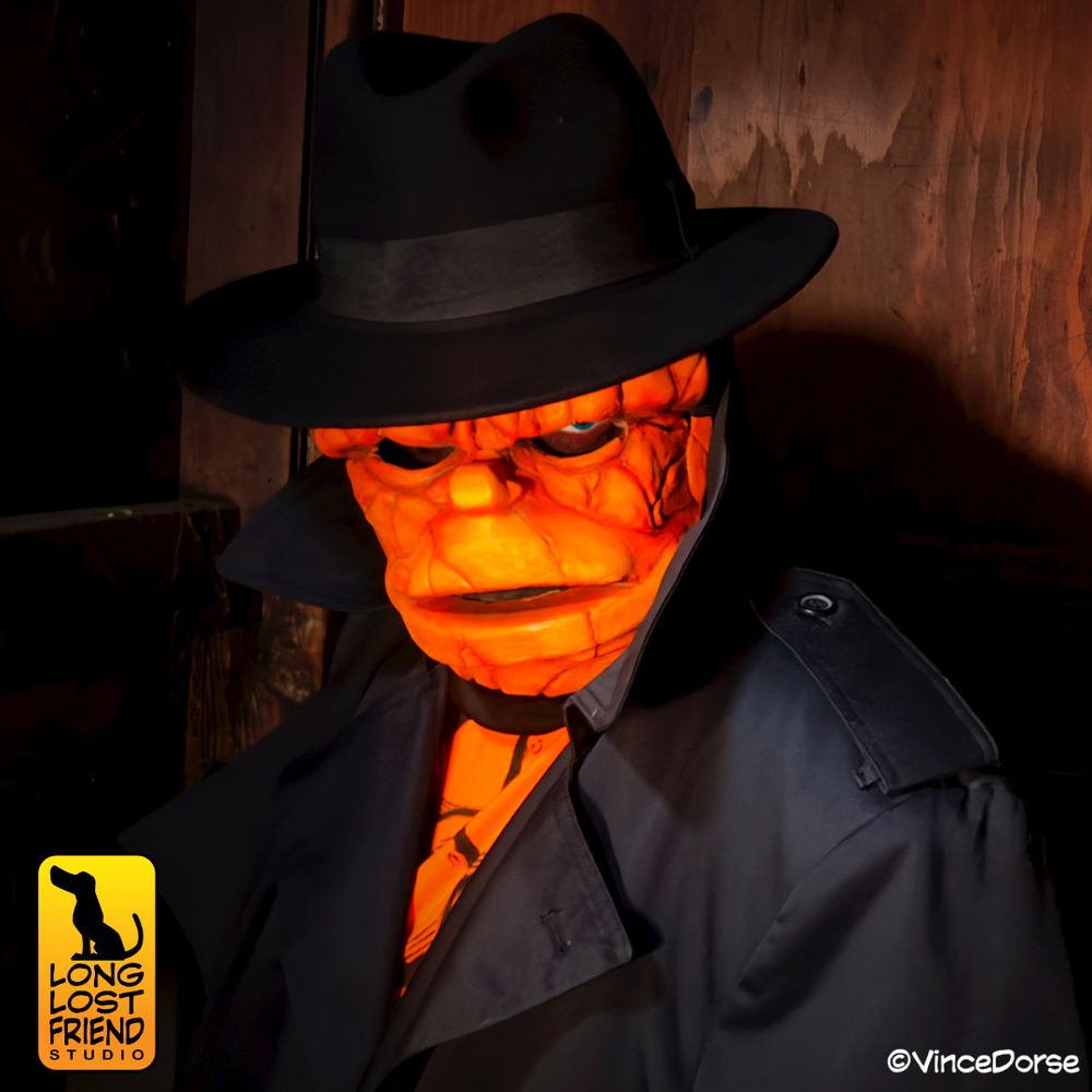 man wearing a homemade Ben Grimm Thing mask, along with trench coat, fedora, and a shirt made to look like The Thing's rocky torso