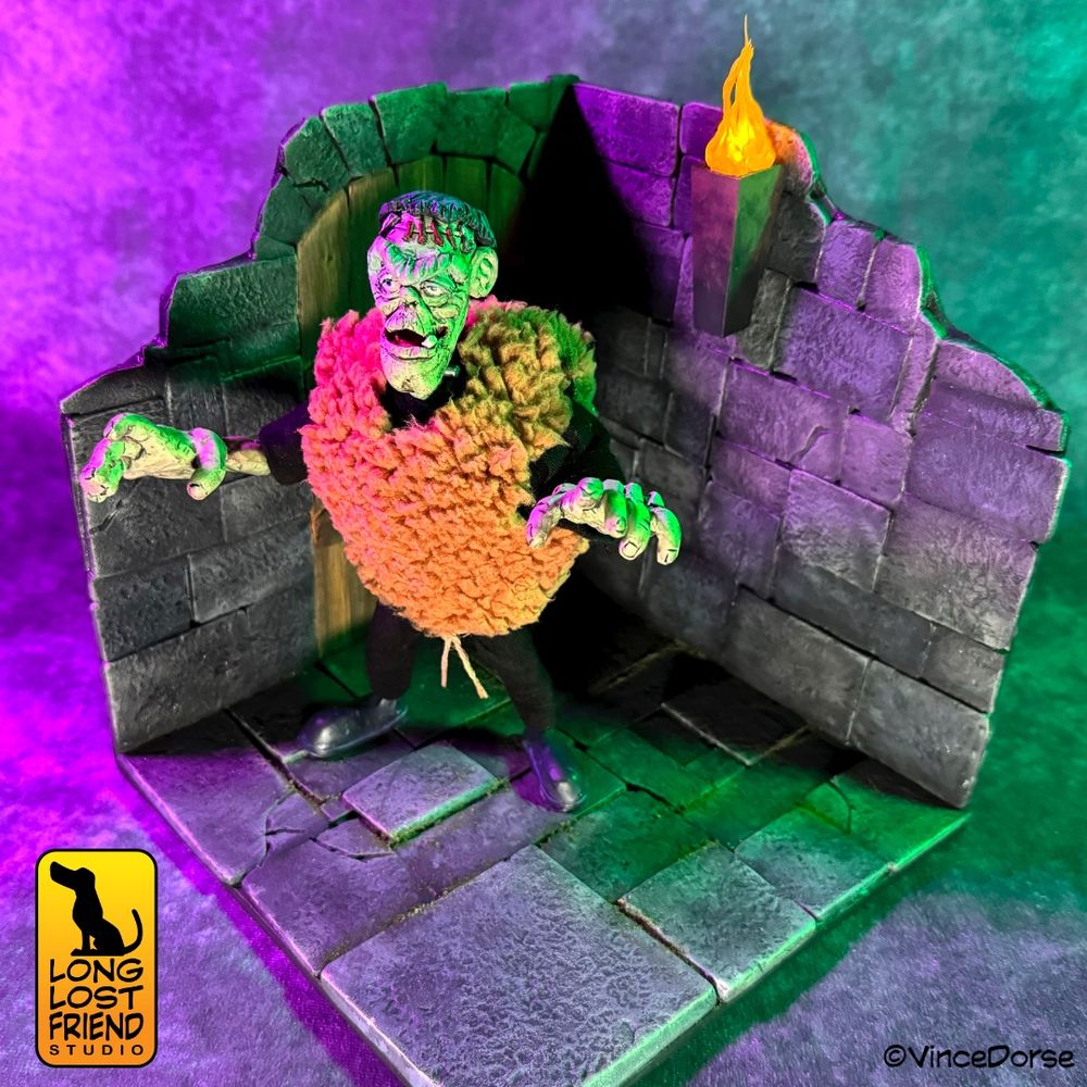 finished monster diorama with Frankenstein art doll standing in the gothic castle diorama base