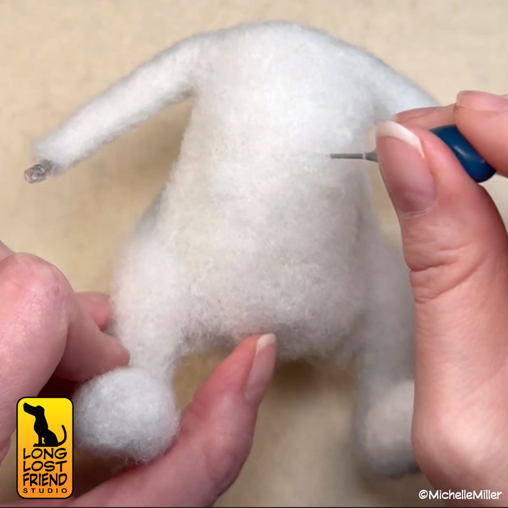 Needle feting Yoshi's body. Using poly fill as the core wool and needle felting with a 42t needle. 