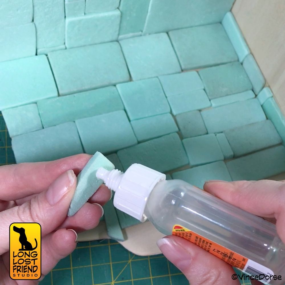 gluing foam stones onto wooden frame