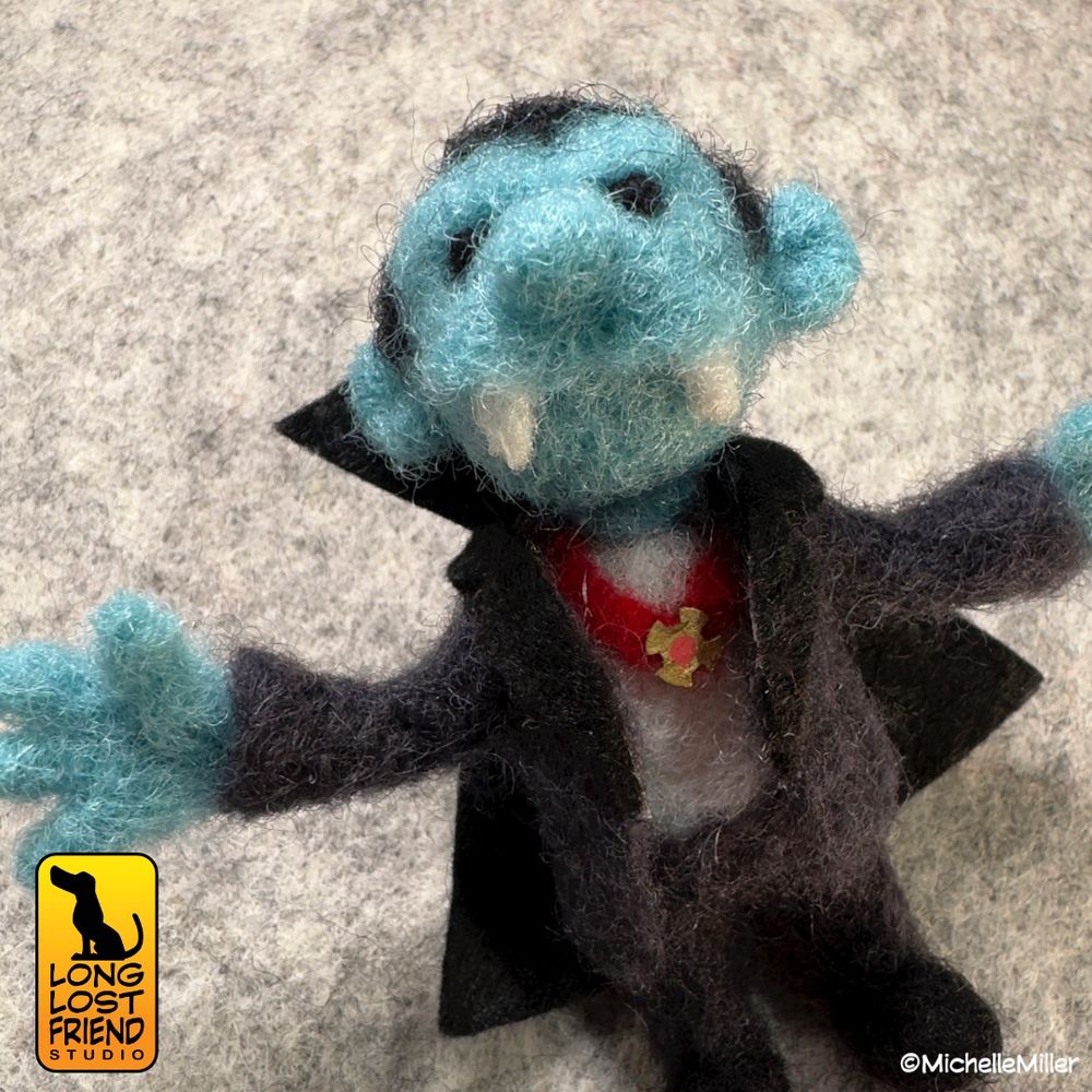 Mini needle felted Dracula figure out if wool. 