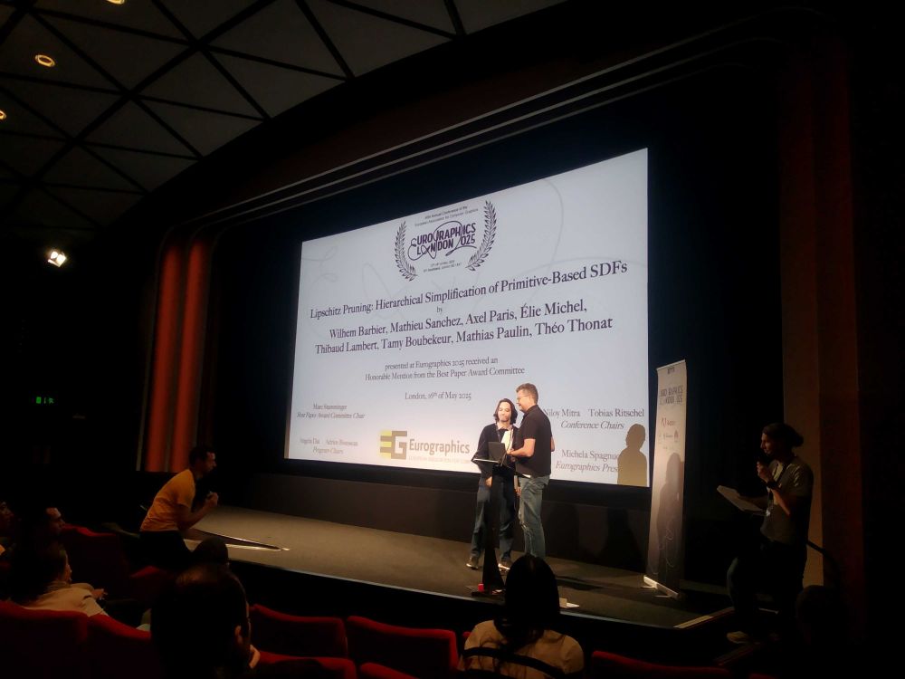 Wilhem receiving the award on stage
