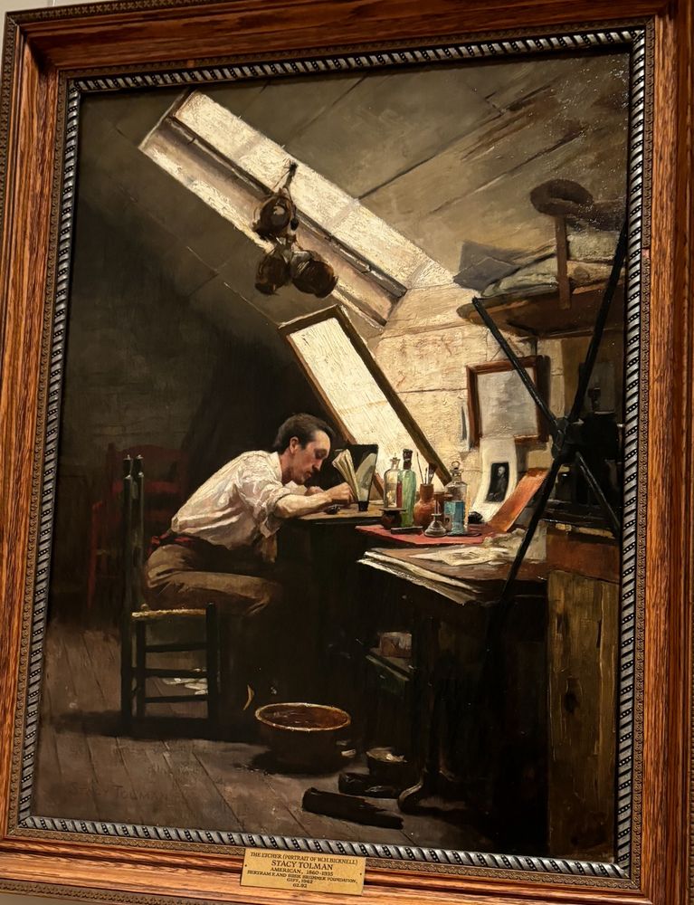 Guy hard at work at his desk 