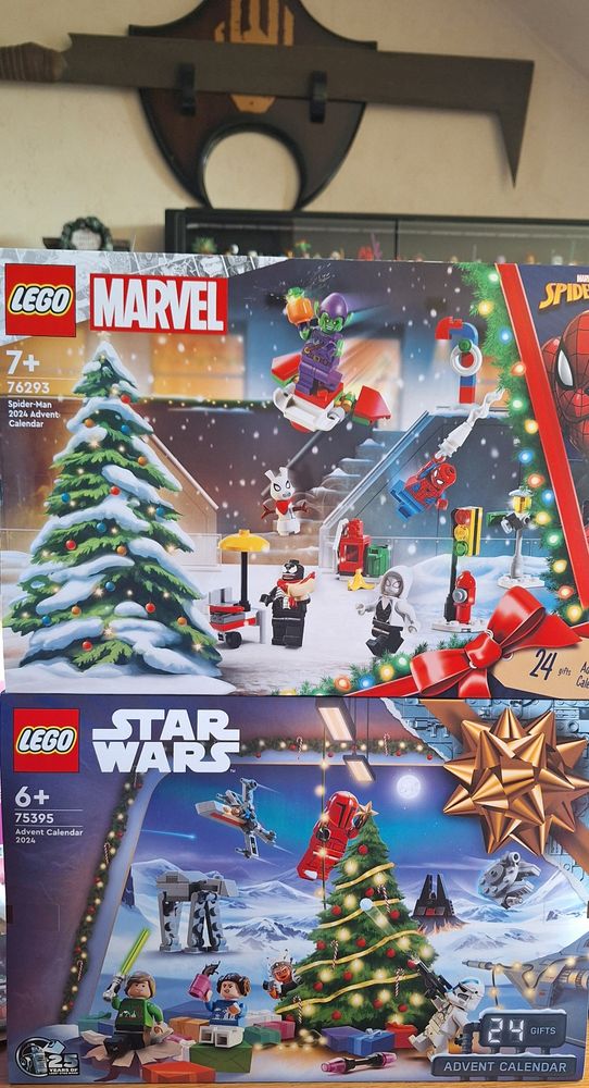 Two lego advent calenders stacked on top of eachother, the 2024 Star Wars one and the 2024 Marvel one