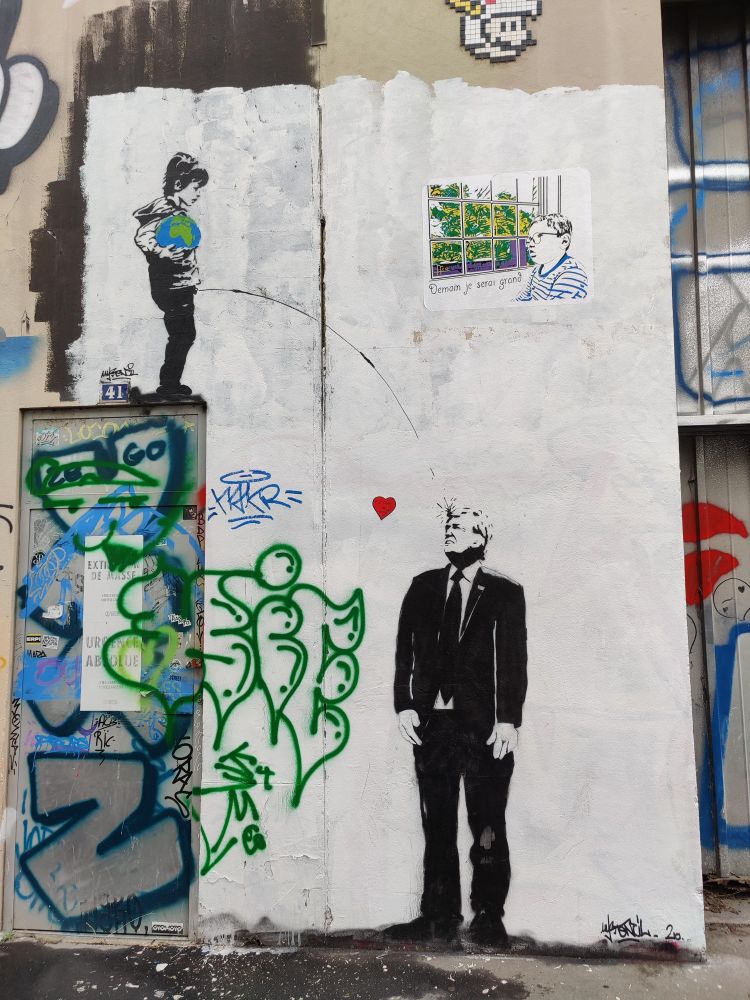 Child holding an earth globe pissing in Donald Trump's face.