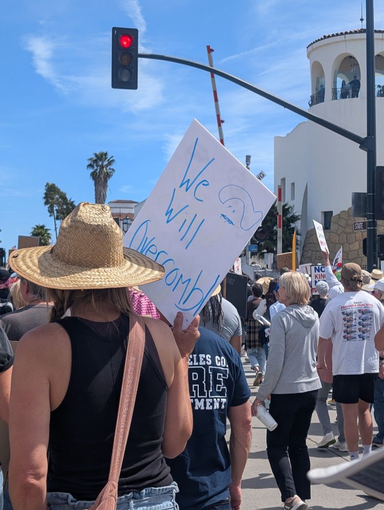 Hands off protesters with sign, We Will Overcomb