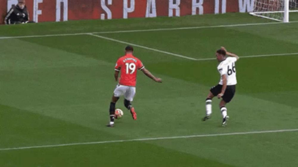 a soccer player with the number 7 on his jersey is running towards a goal