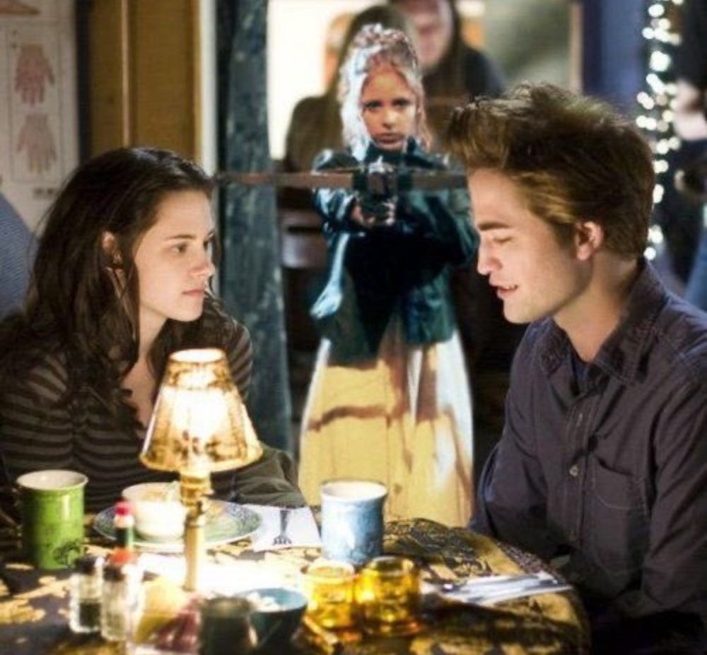 Meme showing Bella and Edward from Twilight while Buffy the vampire slayer points a crossbow at him. 