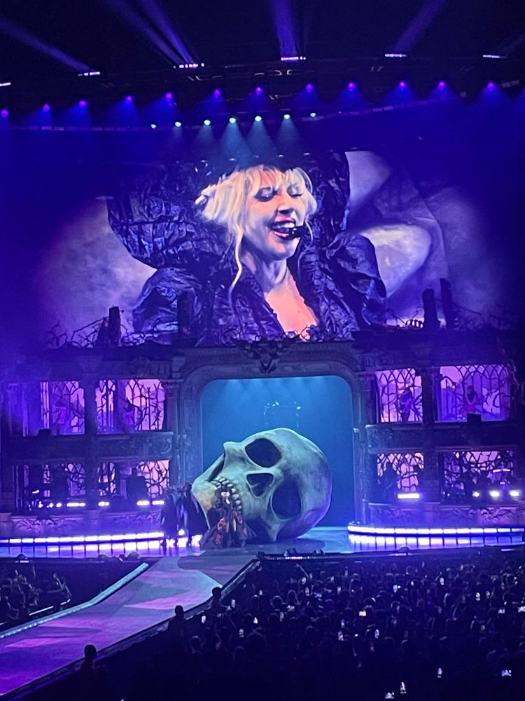 Gaga in front of a large skull set piece 