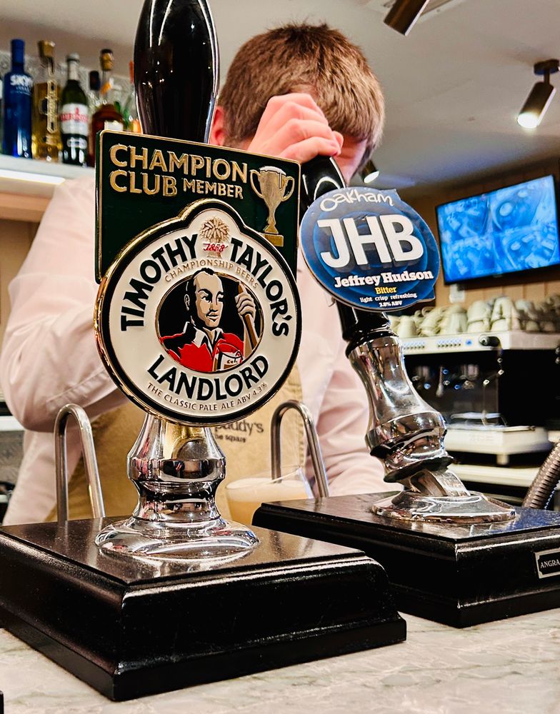 Pint of Oakham Ales JHB being poured, also available, Timothy Taylor’s Landlord.