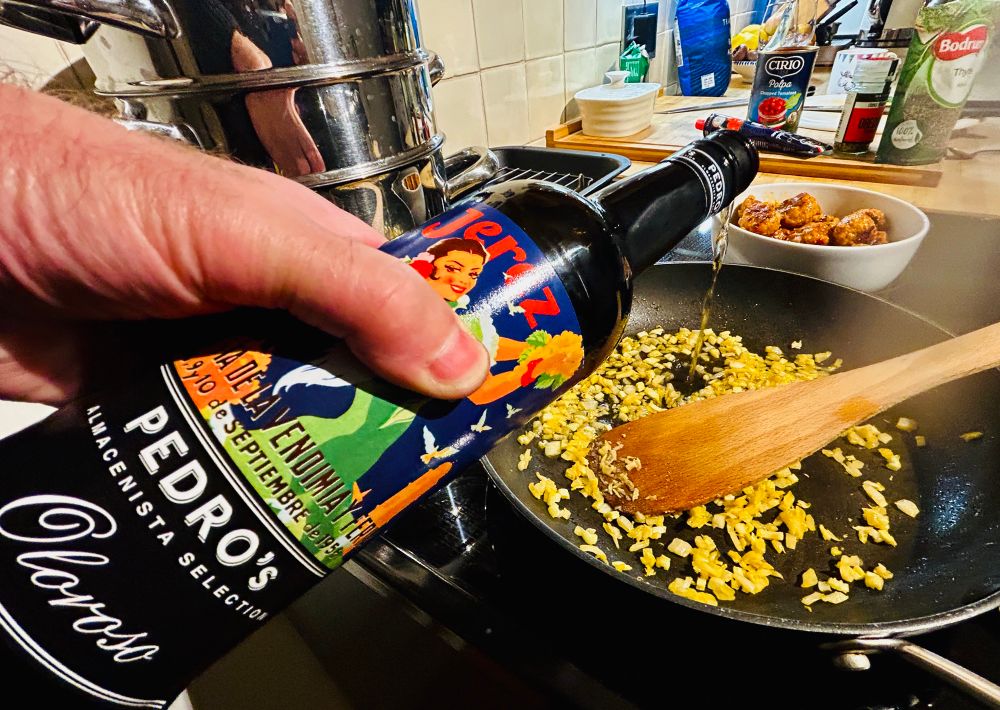 Sherry going into the pan for the sauce.
