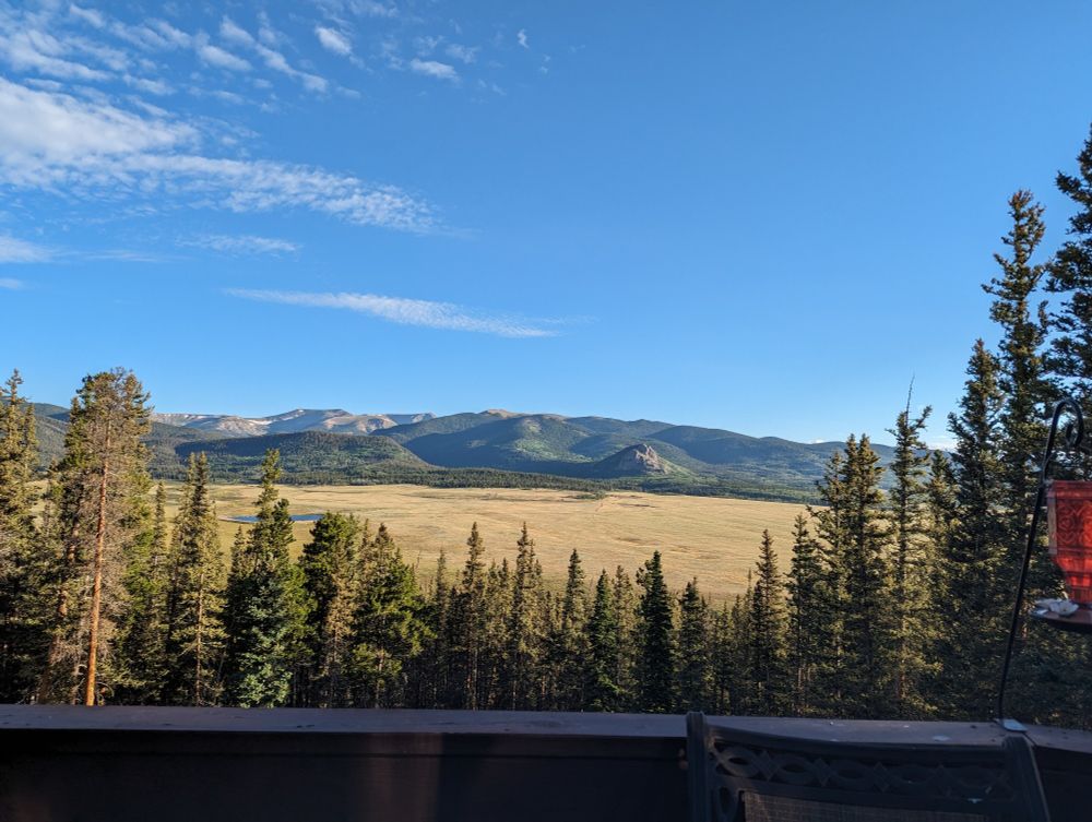 Photo of valley and mountains in Jefferson Colorado with the blue sky above
