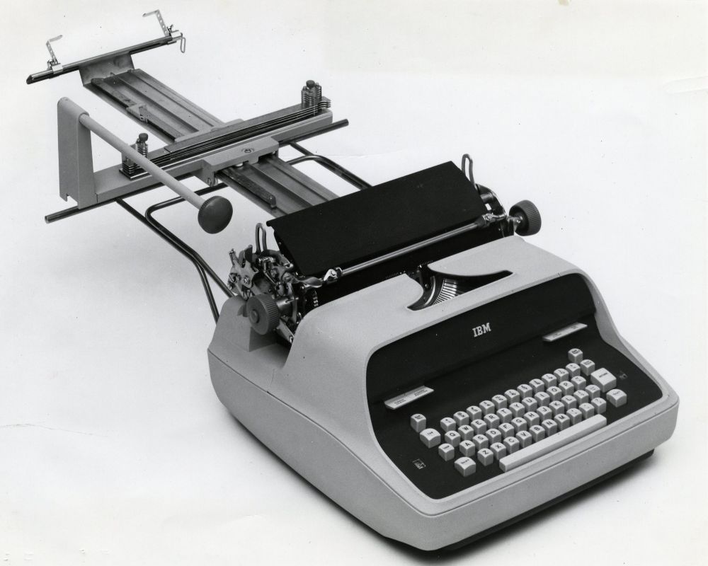 A photo of an IBM Model C Electric Formswriter, a typewriter-based device with a special carriage and assembly for feeding long, continuous forms.