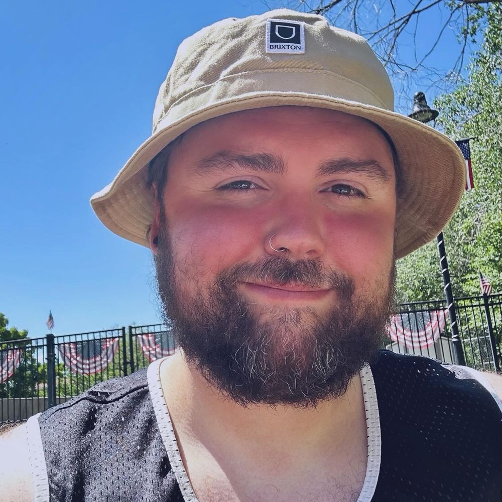 A selfie of me in the sun with a bucket hat on