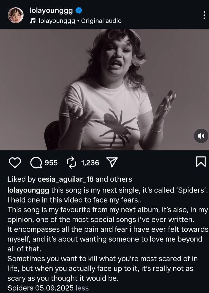 Lolayoung promoting her new song spiders with a spider on her shirt 