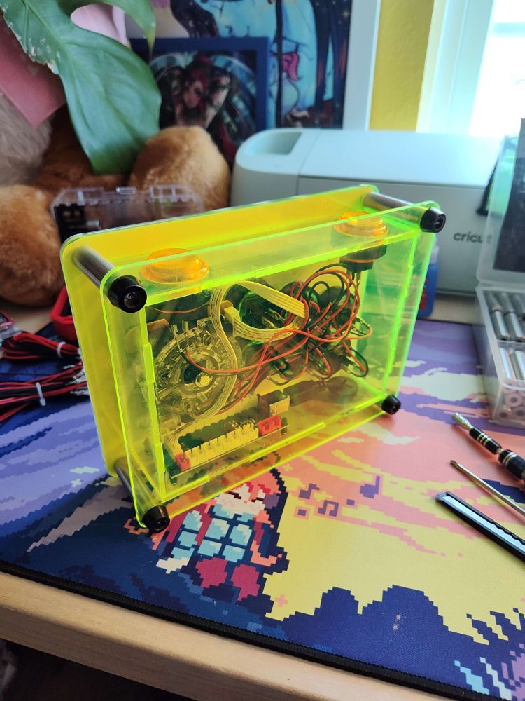 Bottom shot of the metroid arcade stick, with fluorescent transparent green acrylic so you can see the wires and electronics 