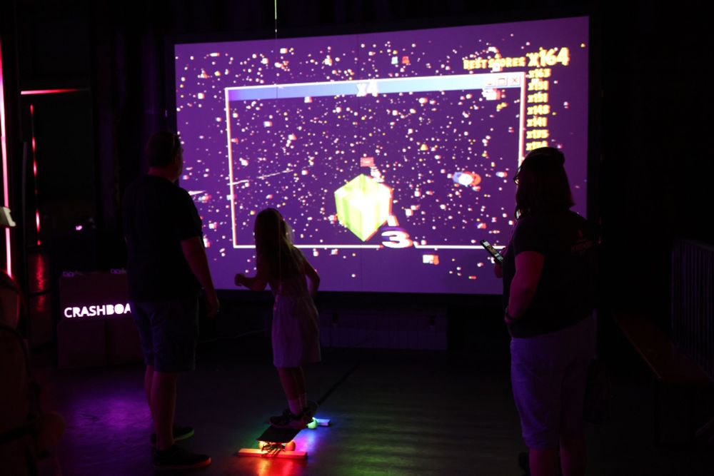 Crashboard being played by a little girl with her parents in AMAZE Sheffield, UK in 2024.
Credit photo : Daniella Sasaki 