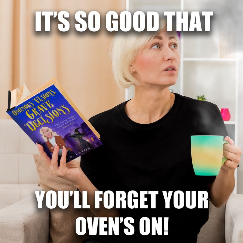 A platinum blonde woman holding a steaming mug, holding the opened book titled Ominous Visions, Grave Decisions by K.D. Upton and seated in a comfy chair with the caption: It's so good that you'll forget your oven's on!