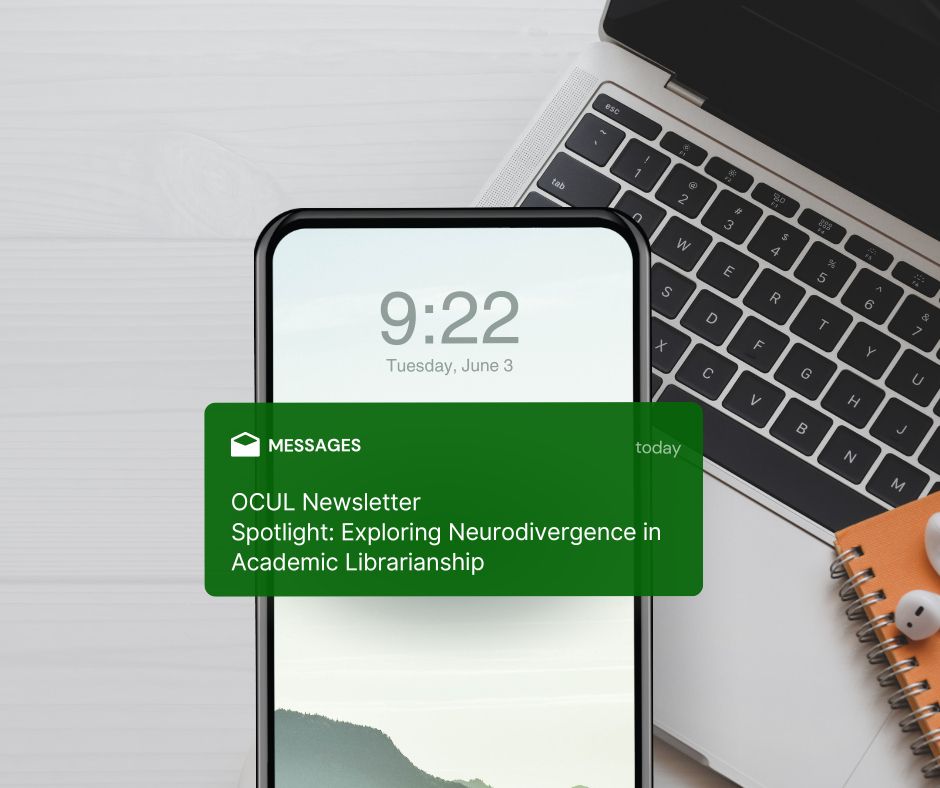 A laptop, notebook and Air Pods sitting on a desk. At the centre of the desk is a cell phone with its screen showing a message preview of the OCUL email newsletter.