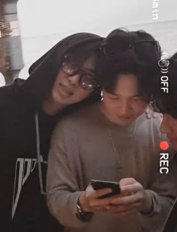 Joon leaning his head on Jimin's shoulder