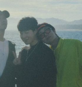 Hobi leaning his head on Jimin's shoulder