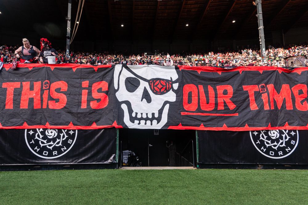 “This is our time” on the rail banner. 