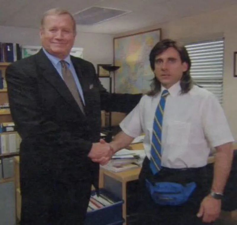 Meme funny photo of a boss business man proudly shaking hands with a doofus looking employee who is like why am i here