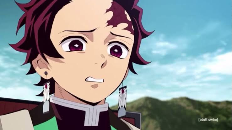 Tanjiro from Demon Slayer anime with a look of disgust on his face. 